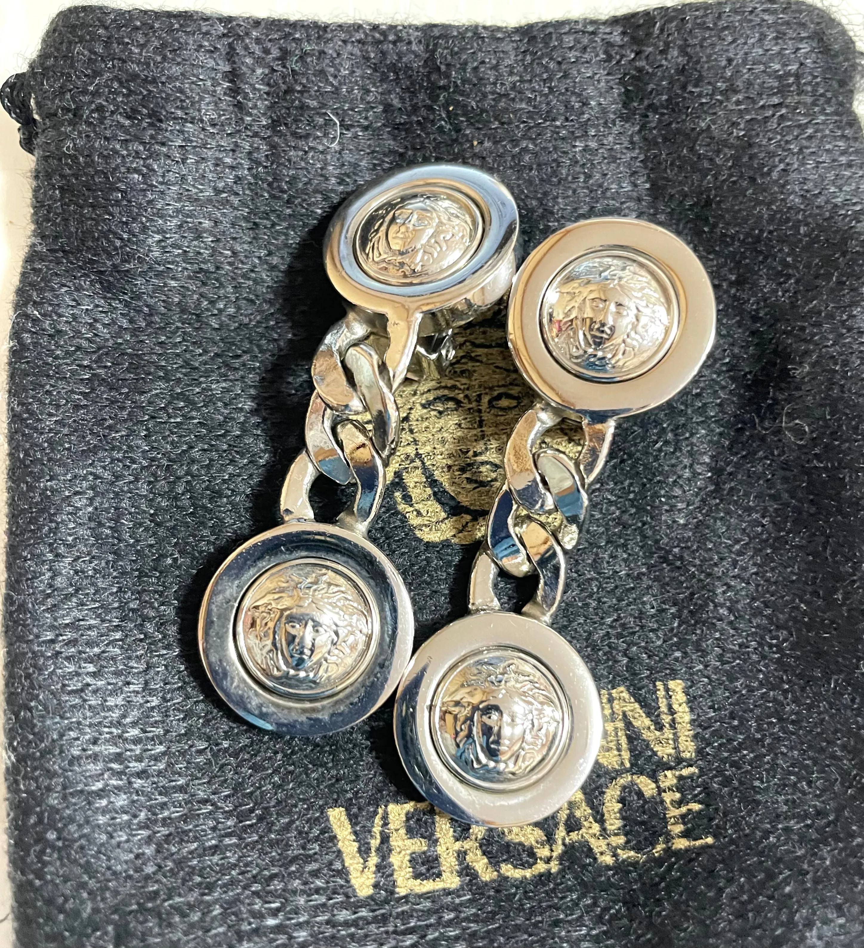 Vintage Gianni Versace silver dangle earrings with medusa faces and chain motif. Must have Lady Gaga style jewelry piece. 050601ya2