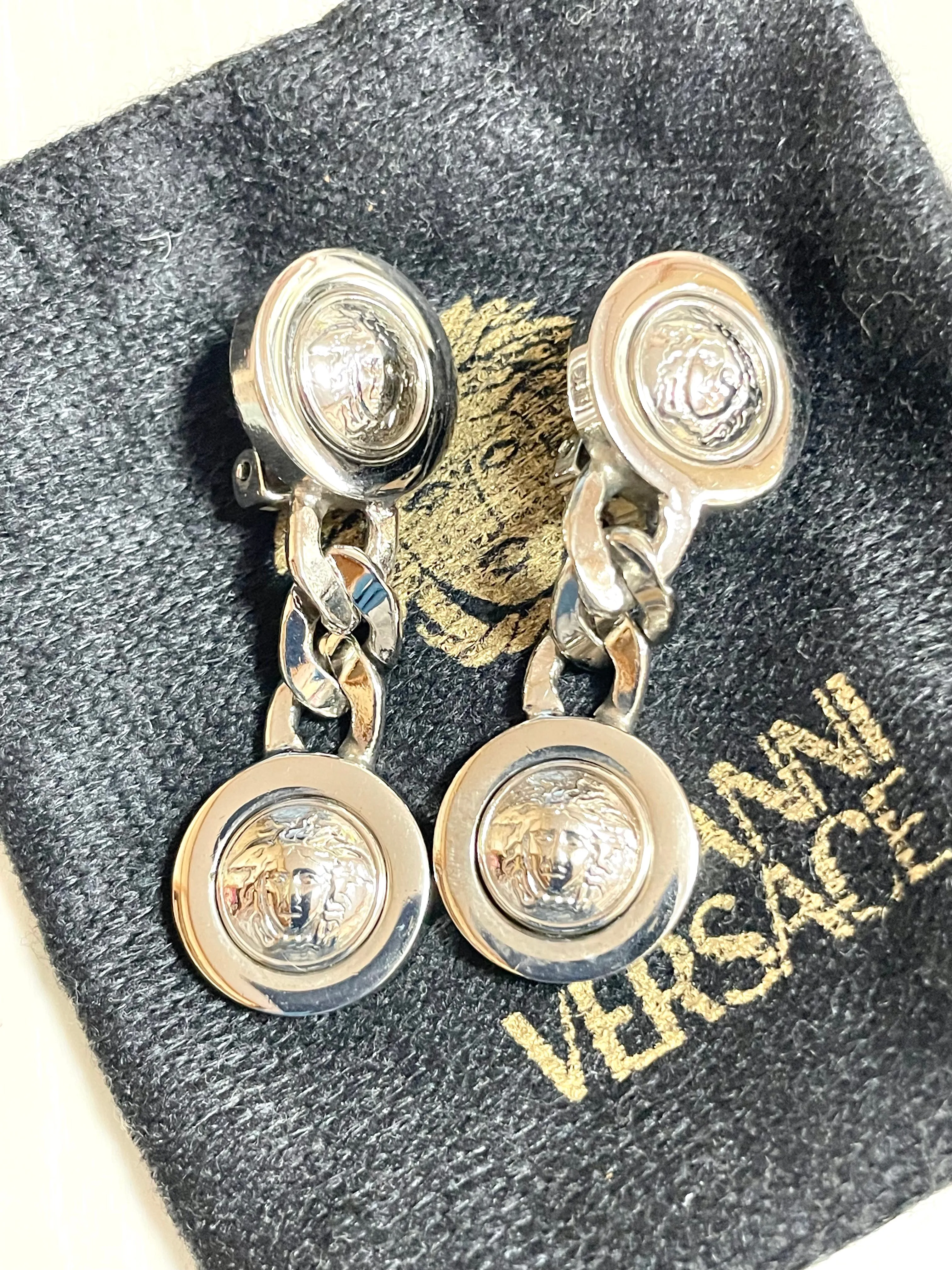 Vintage Gianni Versace silver dangle earrings with medusa faces and chain motif. Must have Lady Gaga style jewelry piece. 050601ya2